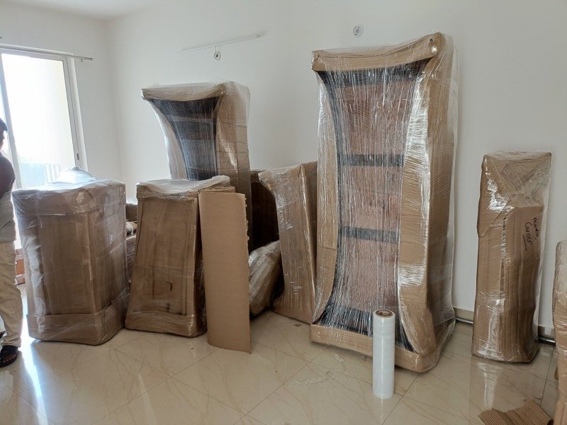 Wardrobe and furniture wrapped in corrugated sheet, Narayan Packers and Movers Lucknow