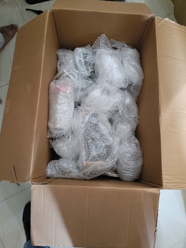 Fragile items bubble-wrapped inside a carton, Narayan Packers and Movers Lucknow